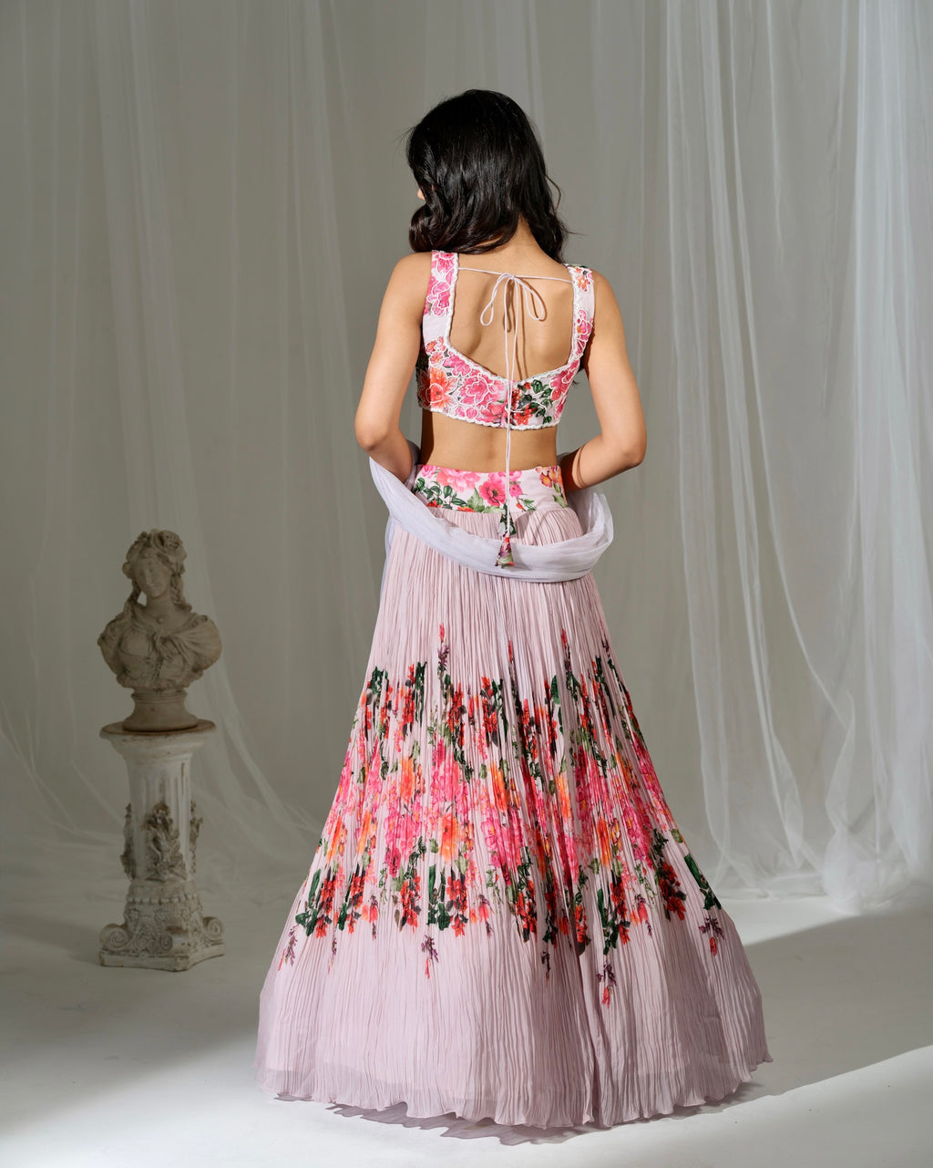 Woman wearing a floral dress with a white background